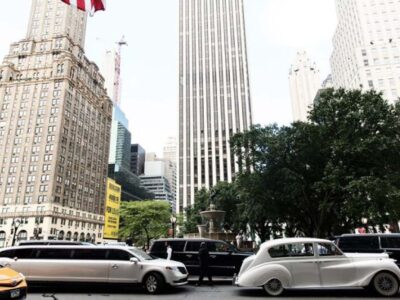 Limousines and vintage car downtown skyscrapers