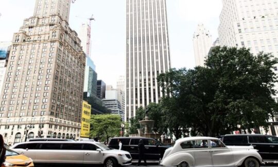 Limousines and vintage car downtown skyscrapers