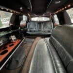 Luxury limousine interior with leather seats and bar