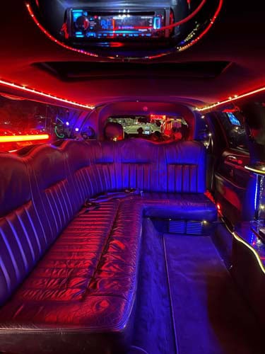 Luxury limousine interior with red and blue neon lighting