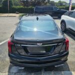 Rear view of black Cadillac CT5 sedan parked