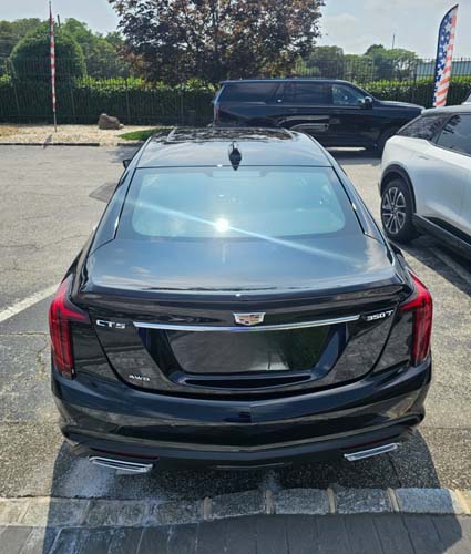 Rear view of black Cadillac CT5 sedan parked