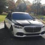 Two tone luxury sedan parked on suburban street