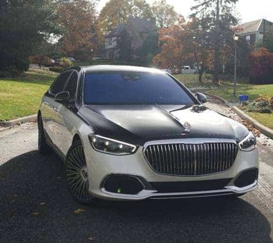 Two tone luxury sedan parked on suburban street