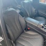Black leather car seats with diamond stitching interior