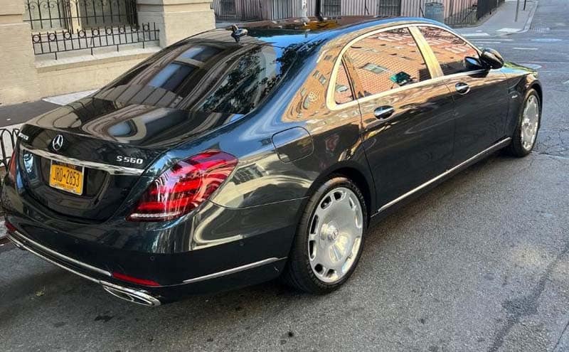 Black Mercedes-Benz S560 sedan parked on street