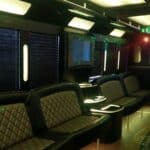 Luxury party bus interior with leather seating and lighting