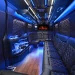 Luxury limousine interior with blue lighting and leather seats