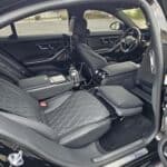 Luxury car interior with quilted leather front seats