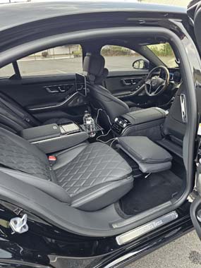 Luxury car interior with quilted leather front seats