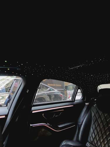 Luxury car interior with starry ceiling lights