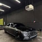 Black luxury sedan in dimly lit garage