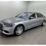 Silver luxury sedan in indoor showroom