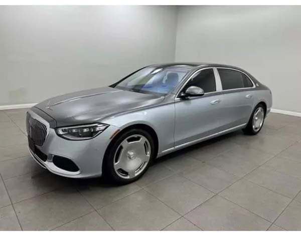 Silver luxury sedan in indoor showroom