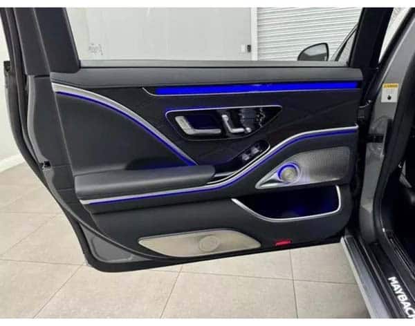 Car door interior with blue ambient lighting