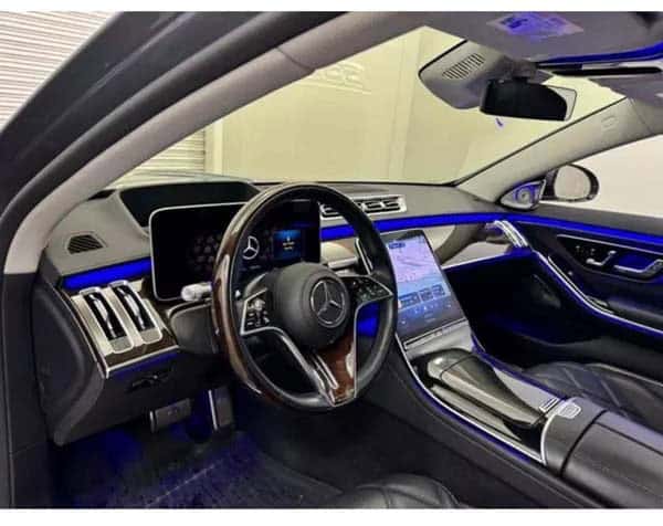 Luxury car interior with blue ambient lighting
