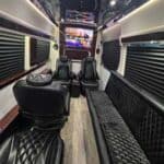 Luxury van interior with leather seats and TV