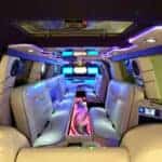 Luxury limousine interior with neon lighting and leather seats