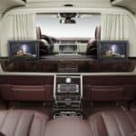 Luxury car rear cabin with leather seats and screens