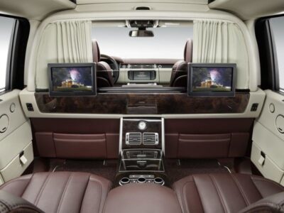 Luxury car rear cabin with leather seats and screens