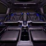 Luxury SUV interior with fold-flat rear seats and blue lighting