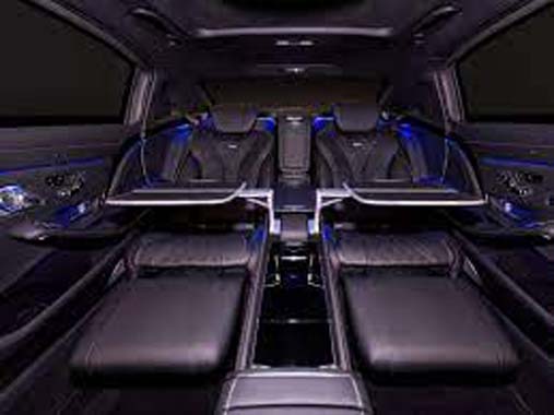 Luxury SUV interior with fold-flat rear seats and blue lighting