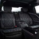 Luxury car rear seats with black leather interior