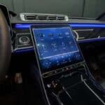 Luxury car interior with large touchscreen dashboard display