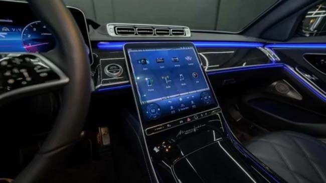Luxury car interior with large touchscreen dashboard display