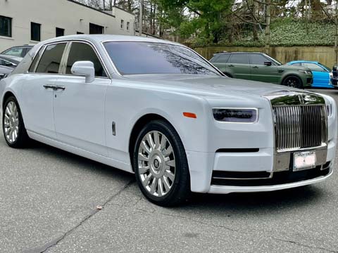 White Rolls-Royce Phantom parked outdoors