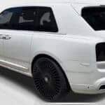 White luxury SUV with black wheels rear view