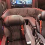 Luxury van interior with leather seats and TV