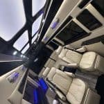 Luxury van interior with leather seats and ambient lighting