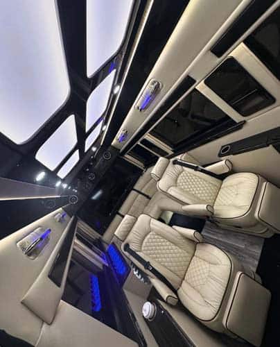 Luxury van interior with leather seats and ambient lighting