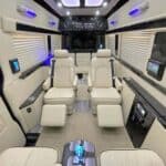 Luxury van interior with reclining leather seats and lighting