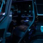 Luxury car rear interior with blue ambient lighting