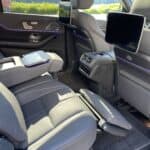 Luxury car rear seats with entertainment screens