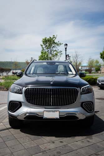 Front view of silver Mercedes-Maybach SUV parked outdoors