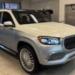 Silver Mercedes-Maybach GLS SUV in showroom garage