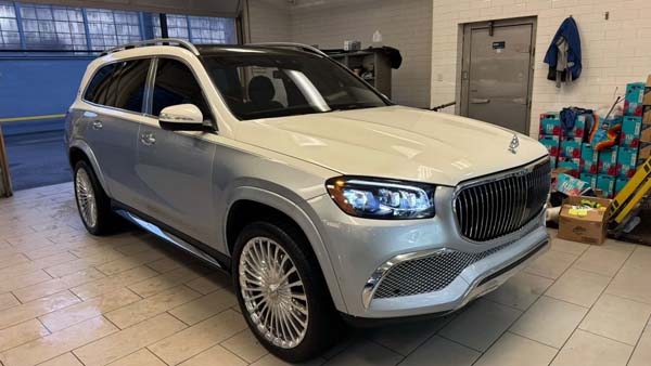 Silver Mercedes-Maybach GLS SUV in showroom garage