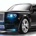 Black luxury sedan with blue headlights and chrome grille