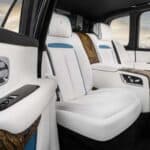 Luxury car rear interior with white leather seats