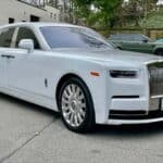 White Rolls-Royce luxury sedan parked outdoors