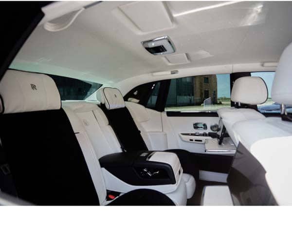 Luxury car rear seats with white leather interior