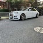 White Rolls-Royce sedan parked on residential street