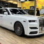 White Rolls-Royce sedan inside auto workshop