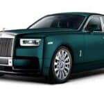 Dark green Rolls-Royce luxury sedan studio shot