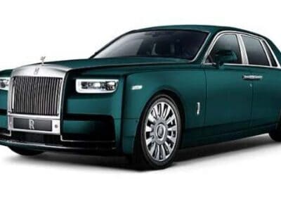 Dark green Rolls-Royce luxury sedan studio shot