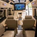 Luxury van interior with leather seats and large screen