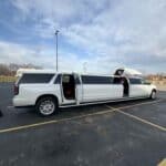White stretch limousine parked with doors open